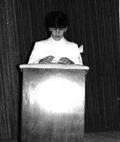 A person standing at the top of a podium